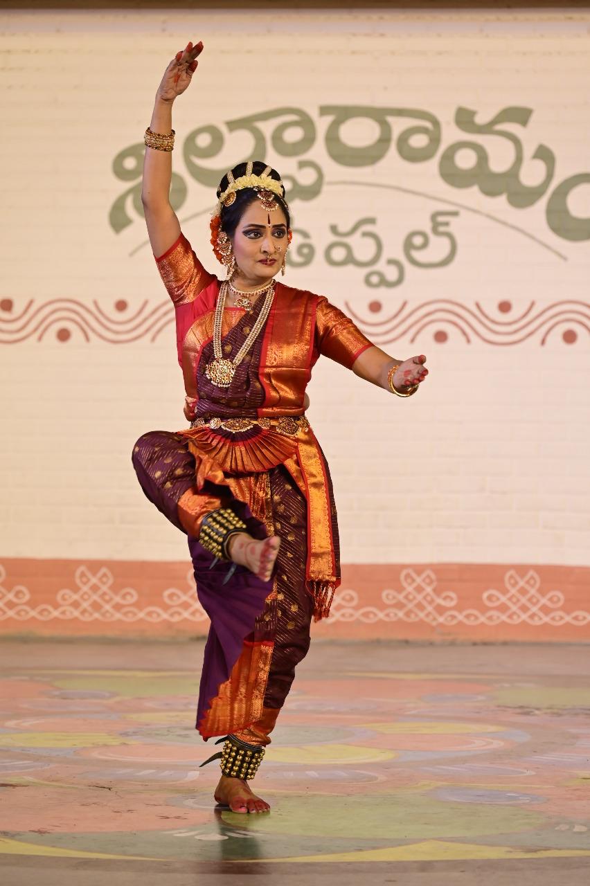 Kuchipudi dancer holding a classical dance pose on stage
