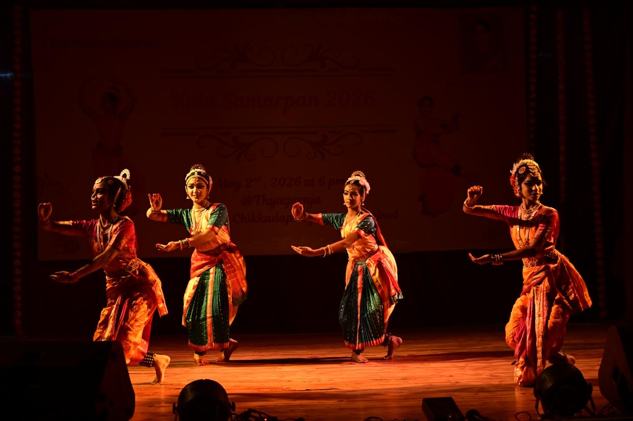 Dancers performing in warm stage light